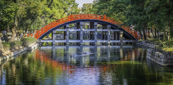 japan-traditional-wooden-arch-bridge-over-tranquil-river-panorama-osaka-2